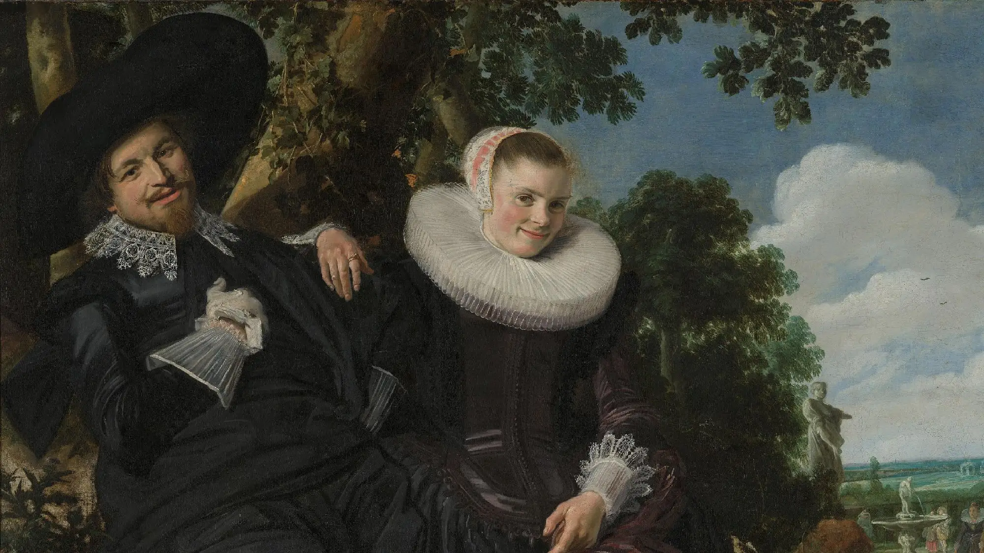 Smiling 17th-century couple seated in a portrait surrounded by symbols of love